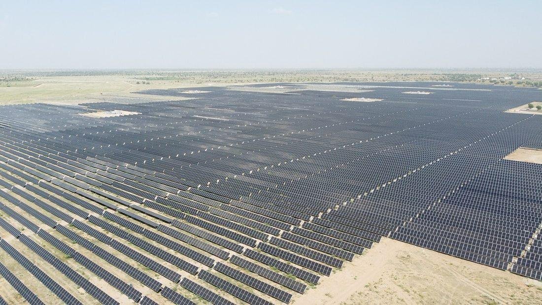 Large-scale industrial solar power plant in India supplying electricity to industry