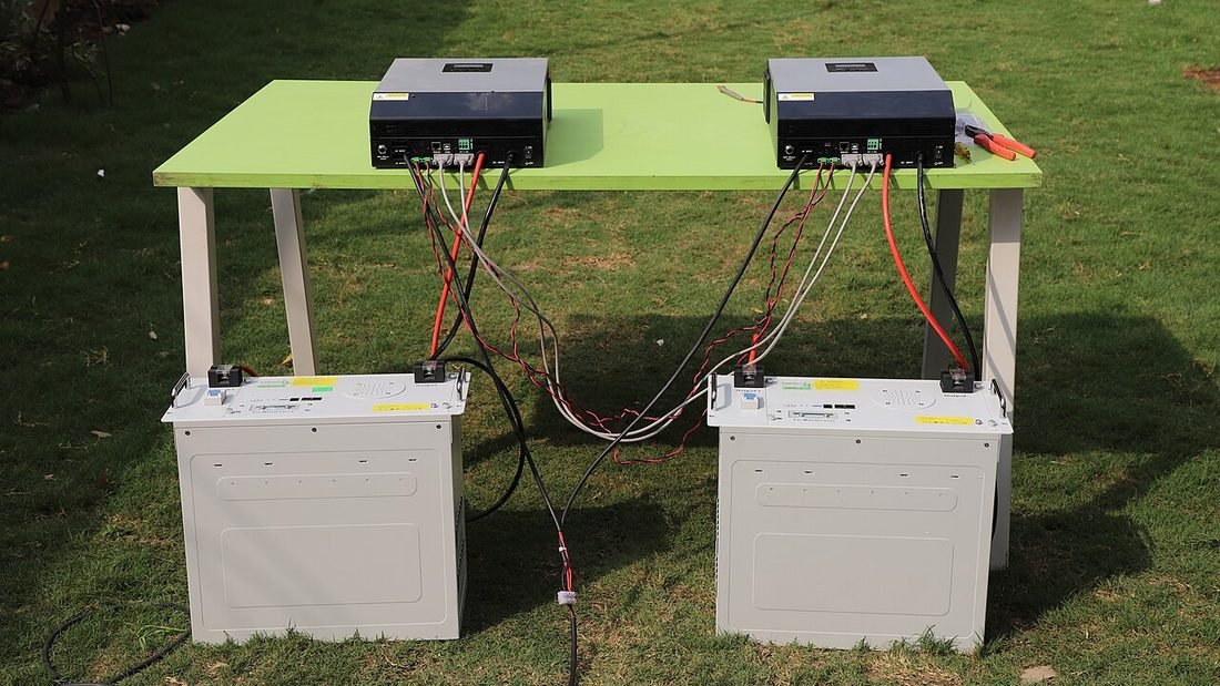 Two solar hybrid inverters connected to battery banks, a home solar battery storage setup for use in Raipur