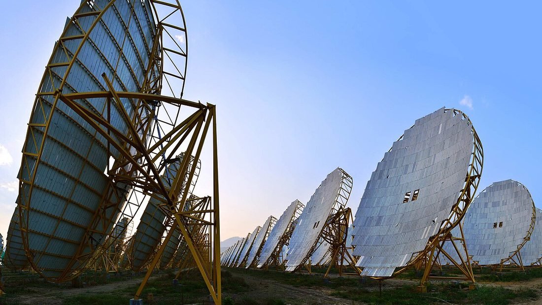 Row of parabolic solar dishes in India, a reminder that careful design matters in every solar project