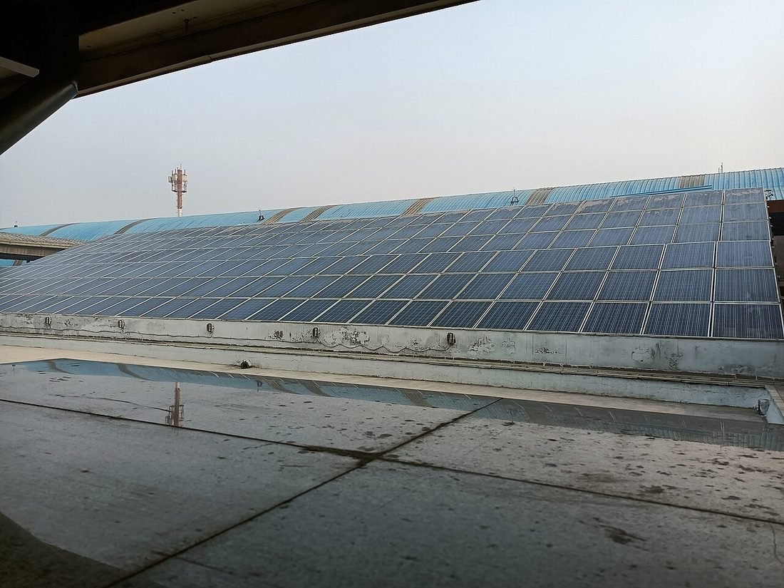 Rooftop solar panel system on an Indian station building near Raipur Junction