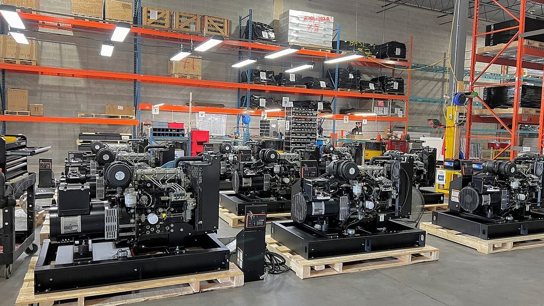 Row of diesel generator sets in a warehouse, used here to compare diesel generator cost with solar power