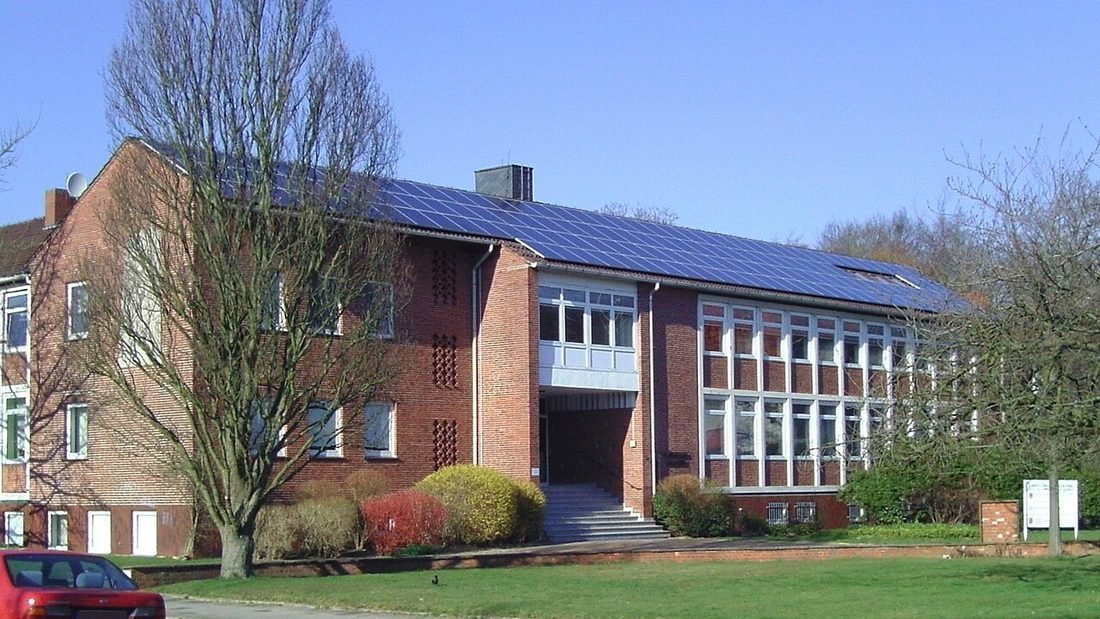 Home with solar panels on its roof, a system covered by panel, inverter and workmanship warranties