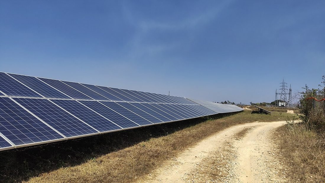 Clean solar panel array in India undergoing maintenance