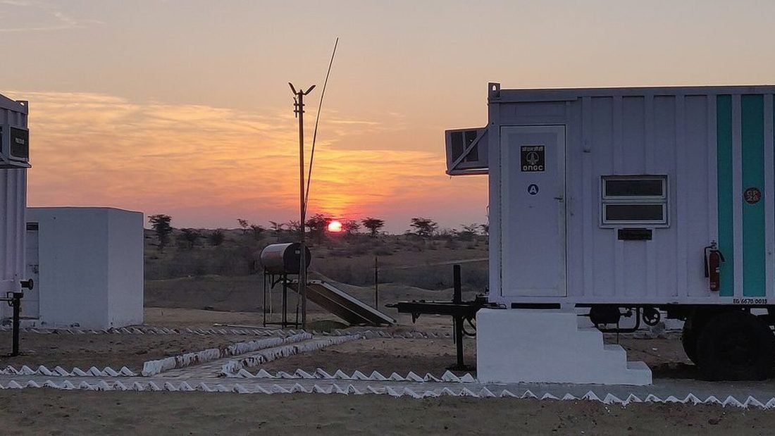 Solar water heater installed on a rooftop in India providing free hot water