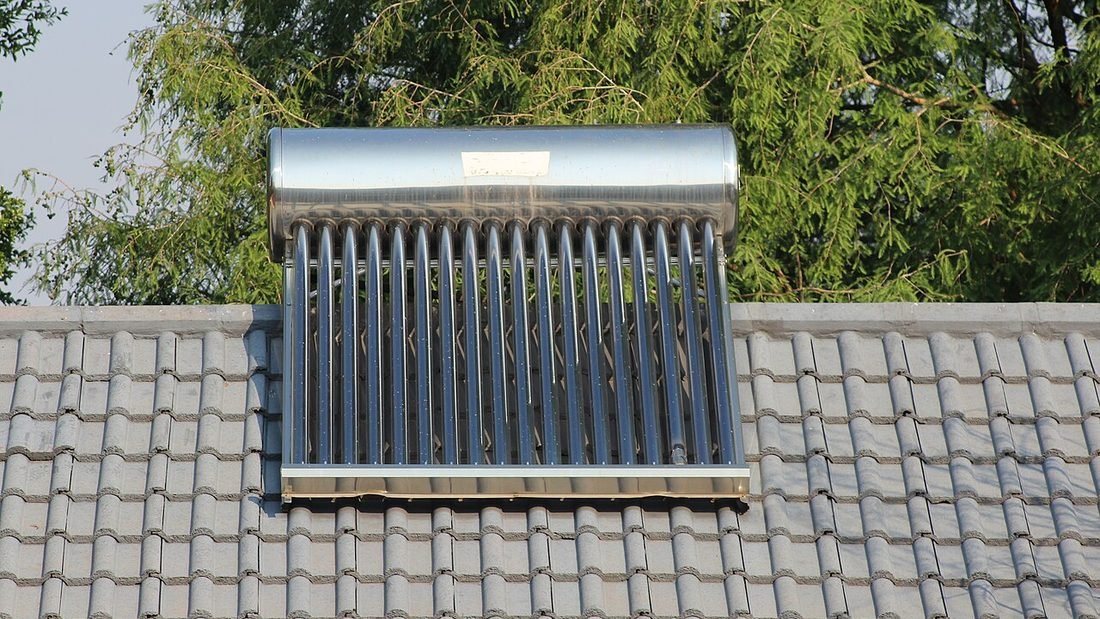 Solar water heater with evacuated tubes on a tiled roof, an alternative to an electric geyser