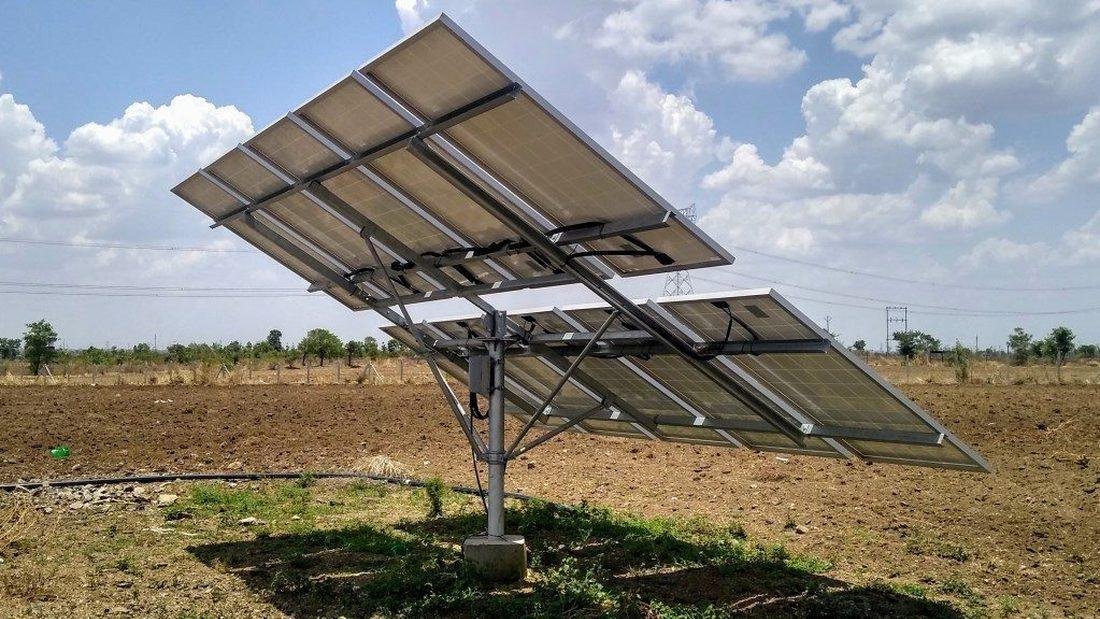 Solar photovoltaic array powering a water pump for irrigation in India